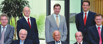 The executive board of the Endress+Hauser Group – standing (from left): Pieter de Koning, Nikolaus Kr&#252;ger and Torsten Knoch. Seated (from left): Roland Kienzler, Michael Ziesemer, Klaus Endress, Fernando Fuenzalida and Dr Heiner Zehntner